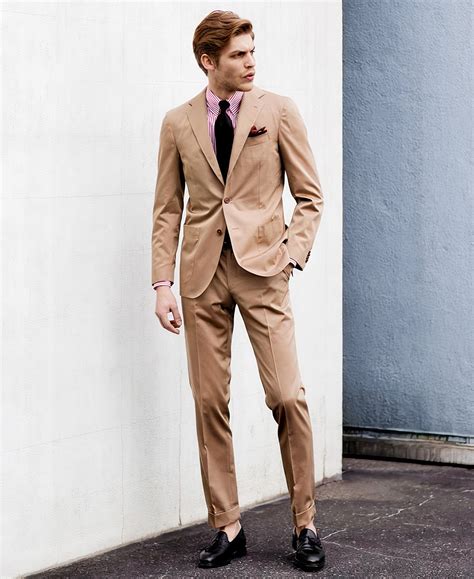 tan suit with pink shirt.